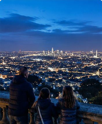 Familia viendo Londres de noche desde Alexandra Palace